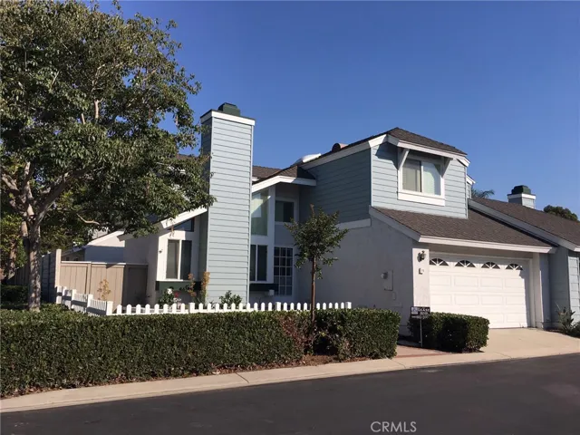 Front of house. Corner lot with beautiful front yard with white picket fence