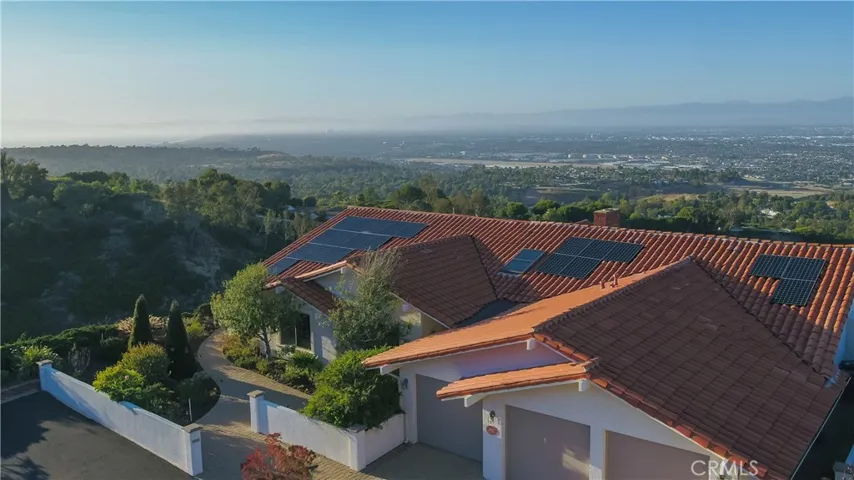 Looking northwest over the LA Basin and Santa Monica Bay. The home includes a three car garage and a fully paid solar system that supplies approximately 90% of the electricity to the home!
