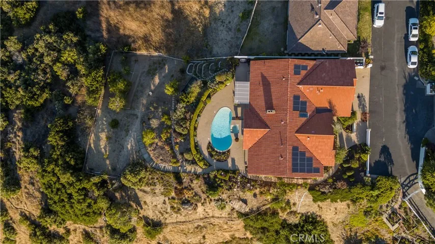 The home is accessed via a private road with ample parking.
