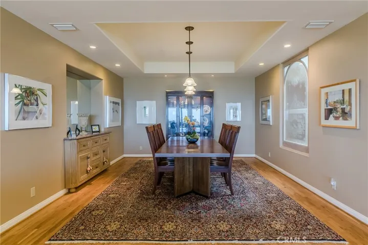 The formal dining room can comfortably seat twelve.