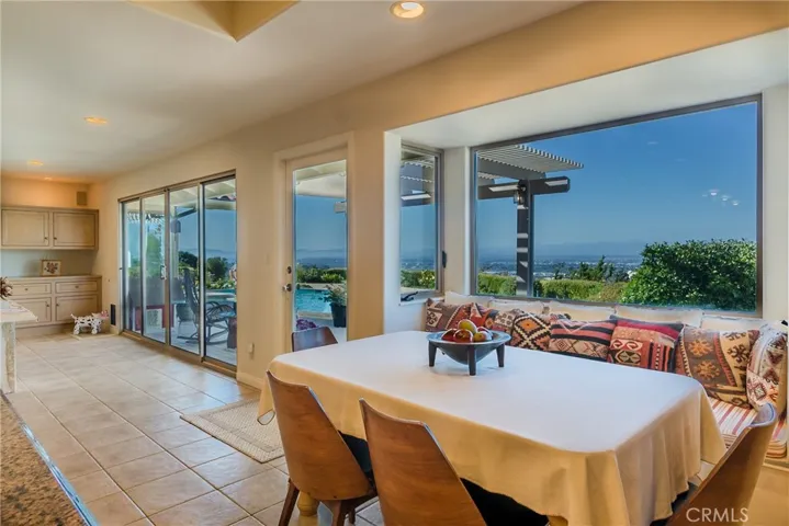 The adjacent breakfast nook includes views from Malibu to the San Bernardino Mountains.