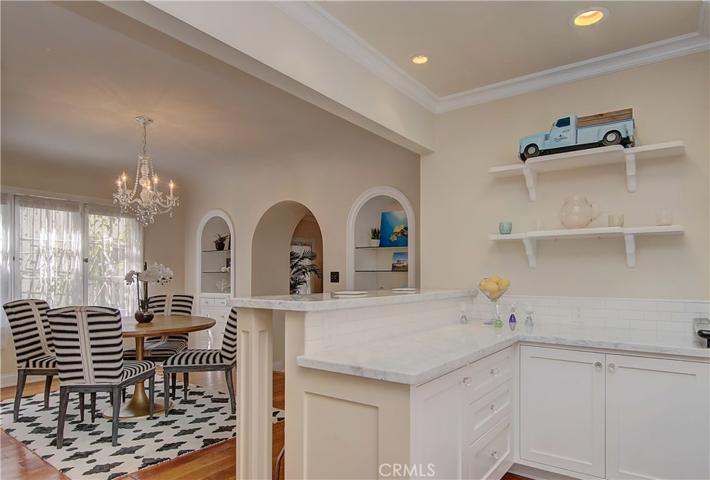 Once again...classic meets contemporary with bulit-ins and arches in an modern, open setting.