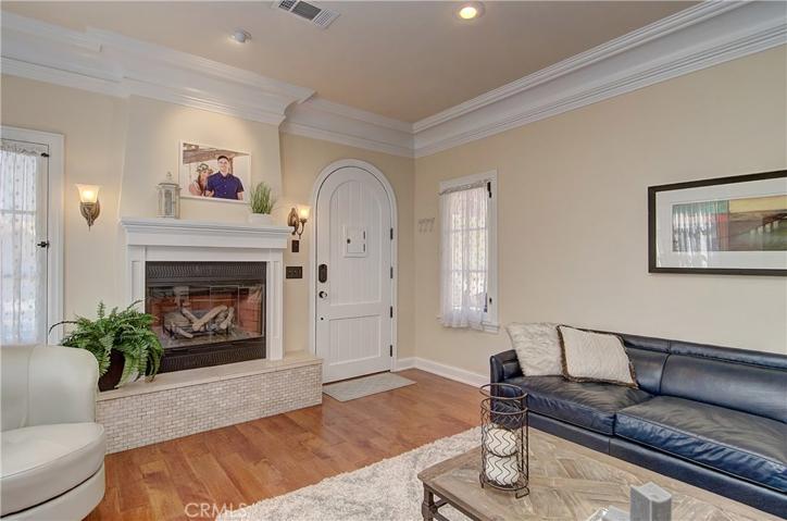 Classic meets contemporary...check out the molding details and hardwood flooring, plus modern fireplace and hearth.
