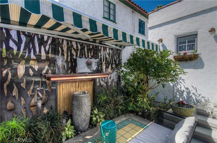 Artistic features abound with custom metal panels, bubling urn, porcelin area rug and retractable awning...and there's even more!