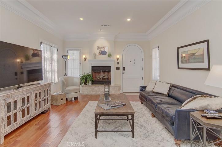 Huge living room has gorgeous architectural elements...restored and enhanced to perfection.
