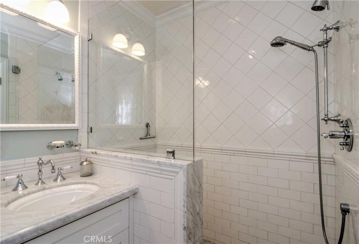 Five star hotel master bath has gorgeous marble details and spa worthy shower.