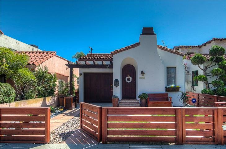 Classic Spanish details, plus contemporary flair combine to create fantastic curb appeal.