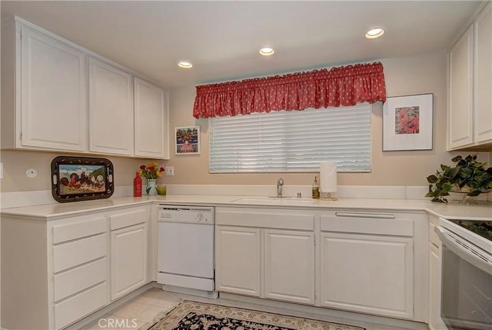 This bright white country style kitchen makes the space feel clean and fresh.