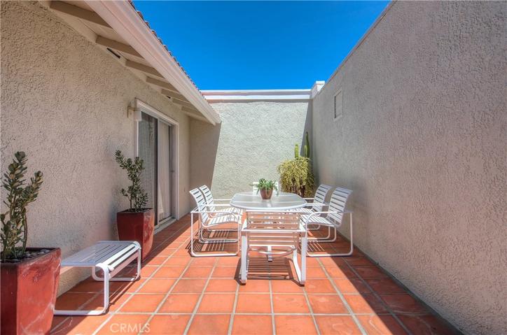 Outdoor patio along the entryway... enjoy your lunch right here on a beautiful summer day.
