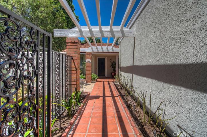 Beautiful long walkway builds excitement upon entering the home.