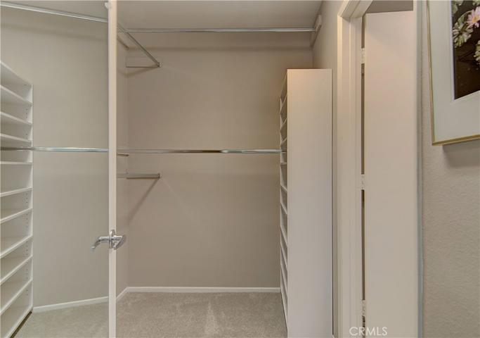 Walk-in closet in master bedroom with organizers..this place is move-in ready.