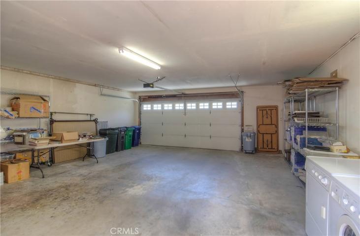 This is a plus-sized 2-car garage! You can easily fit two cars and your cart.