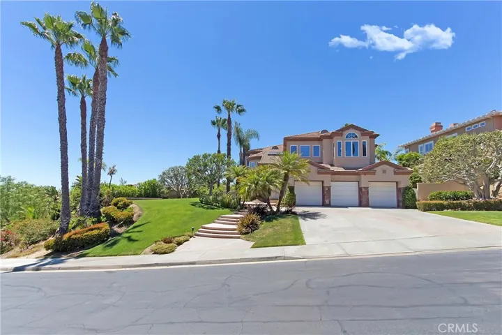 Street View of 11 Emerald Glen located on over 13,000 sq.ft. lot and set up off the street with beautiful breezes.
