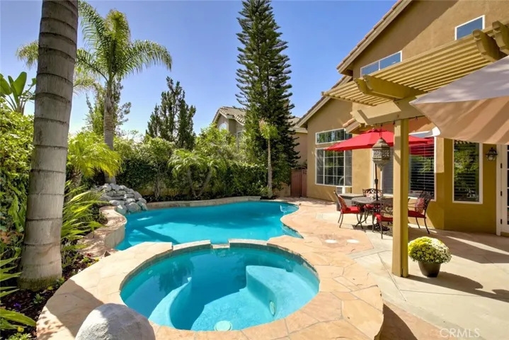 Gorgeous backyard was expertly designed for California living at its best with an abundance of lush tropical foliage!
