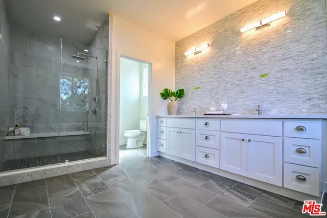 Enormous Master Bath with double glass shower and double vanities