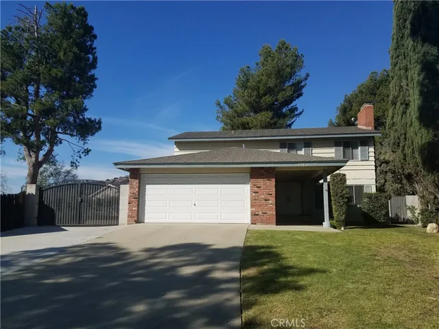 Front of the home. RV parking through the gate to the left.