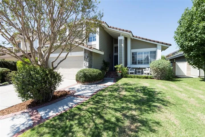 Front view of this lovely home, great curb appeal, 2 car garage, small porch to sit and enjoy some day or evening time.