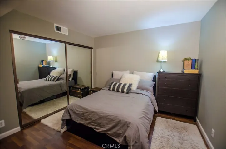 Mirrored closet door in guest bedroom