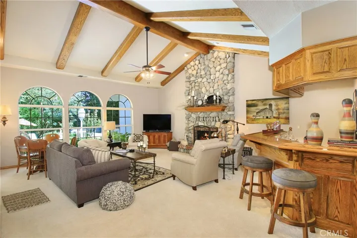 Family Room with Beamed Ceiling, Fireplace and Mini Bar