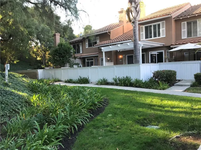 Front entrance located at back end of community with greenbelt and slope view.