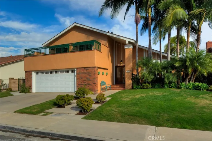Great Madrid home freshly painted exterior with balcony off secondary bedrooms and awnings