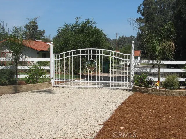 Automatic Front gate which has a keypad and fire department emergency box.