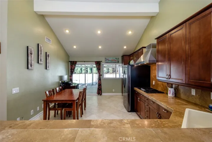 Huge kitchen with stone counters, newer cabinets and appliances.
