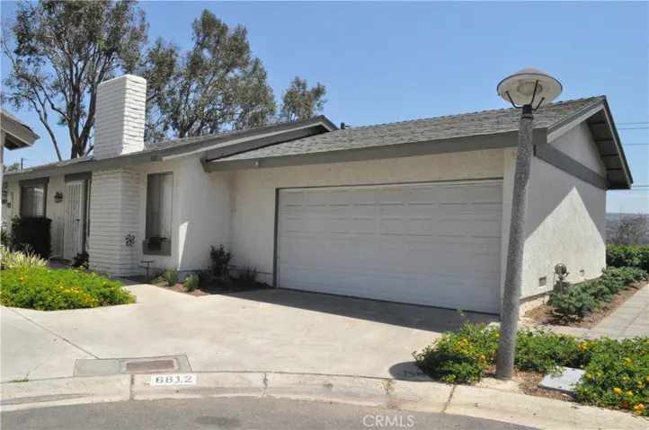 6812 Willow Wick Ct #4 - driveway, 2-car garage and entrance door to the left of the chimney.