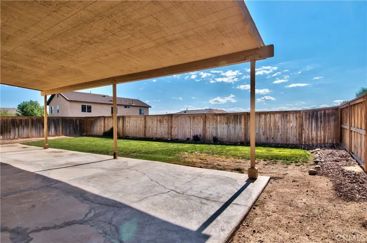 Patio shade structure from backyard.