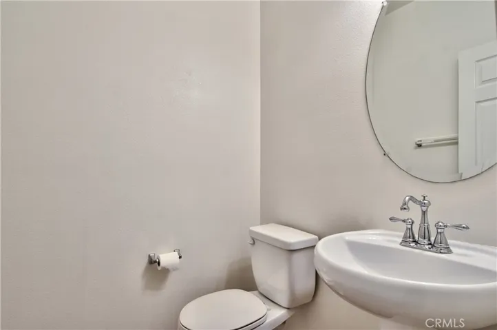 Half bathroom adjacent to office/den.