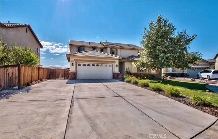 Front yard curb elevation. Wide driveway.