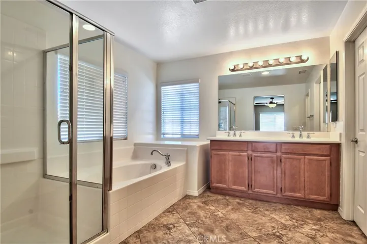 Master bathroom with soaking tub and separate shower. Dual sinks.