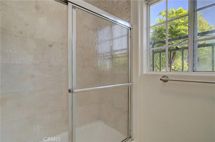 Master bath has marble accents.