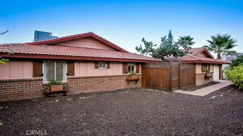 Beautifully designed home with lovely facade and detailed wood entry.