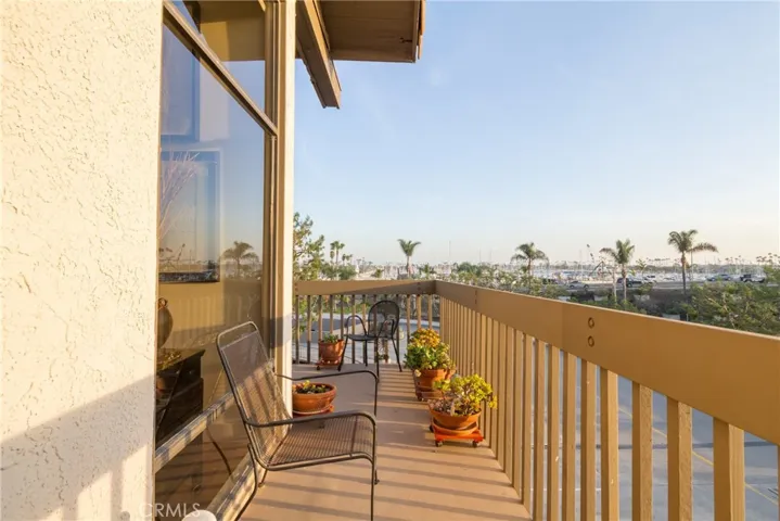 Two Spacious wrap-around balconies with views of the Marina and magnificent sunsets!