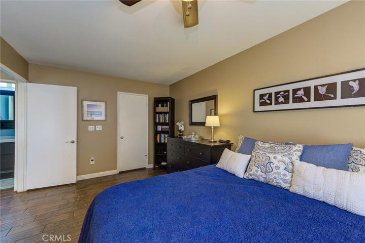 Consider creating a Sitting Area/Library near the corner bookshelves.. This master has options.