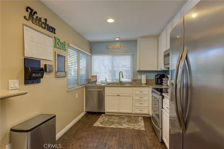 Sunny Corner Windows Really Brings the Light In. And The Cook Will Enjoy the Gleaming Granite Counters & Shiny Stainless Appliances!