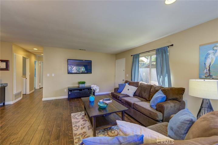 Designer Inspired Paint and Crisp White Moldings Give the Living Room a Contemporay, Yet Comfortable Vibe!