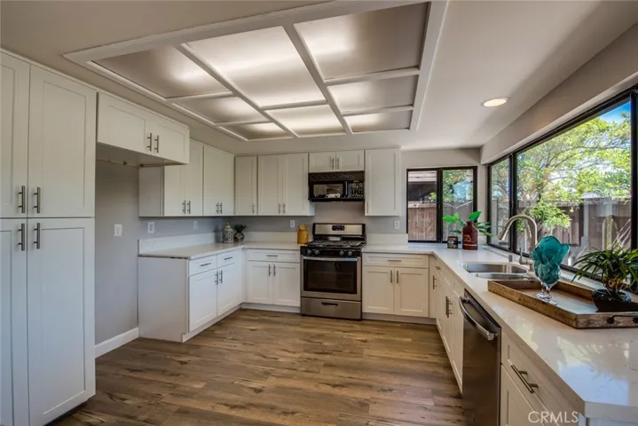 Wow!! Look at this fully remodeled kitchen with upgraded new cabinets, counters,  and floors!!