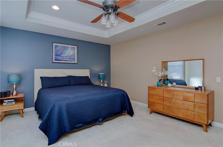 Large bedroom in master suite can accommodate any scale of bedroom furniture...note lovely ceiling detail with crown molding.