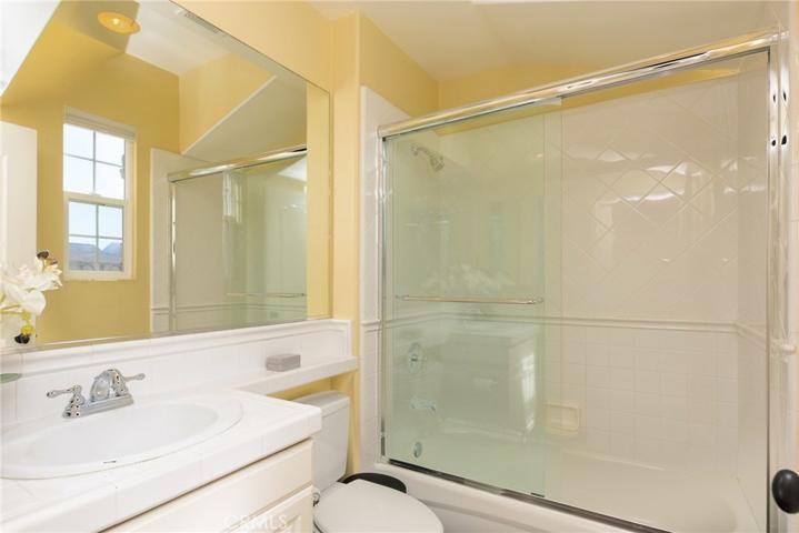 Bright bath in guest suite has nice architectural details.