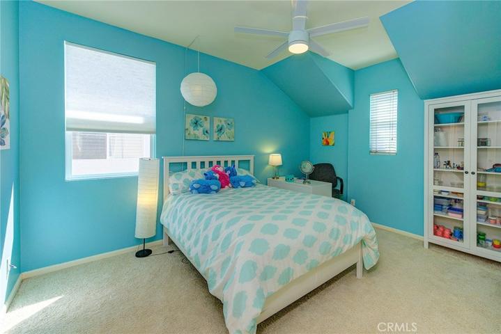 Dormer window gives this oversize kids room a cozy feel.
