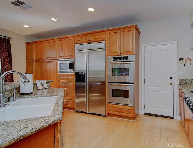 Storage galore with so much pantry and drawer space...double ovens and built-in fridge round out the kitchen features.