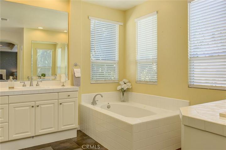 Master bath has two completely separate vanity areas...no bumping into each other in the moring here!...plus large soaking tub and separate shower too.