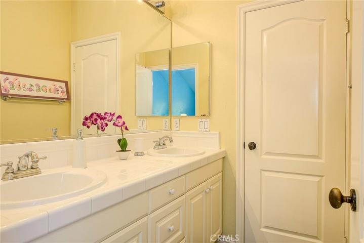 Jack and Jill bath has dual vanity dressing area, plus separate shower and toilet compartment...makes sharing easy.