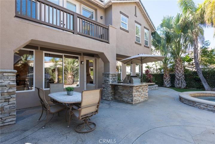 Nice architectural details enhance this beautifully landscaped, private rear yard.