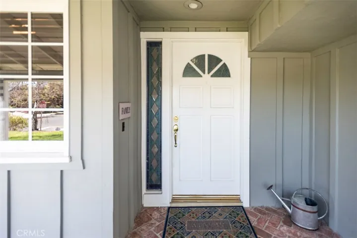 Defined entry with stained glass panel - welcoming to all.