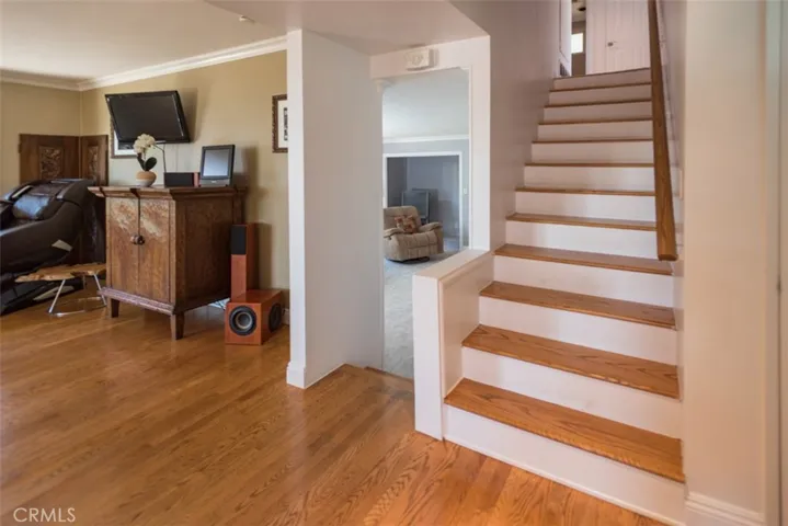 Real hardwood flooring in main living areas. Crown moldings. Fresh painted and new carpet.