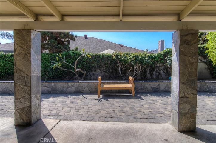 Private rear yard has block wall fencing and gorgeous stone details.  Very low maintenance too!
