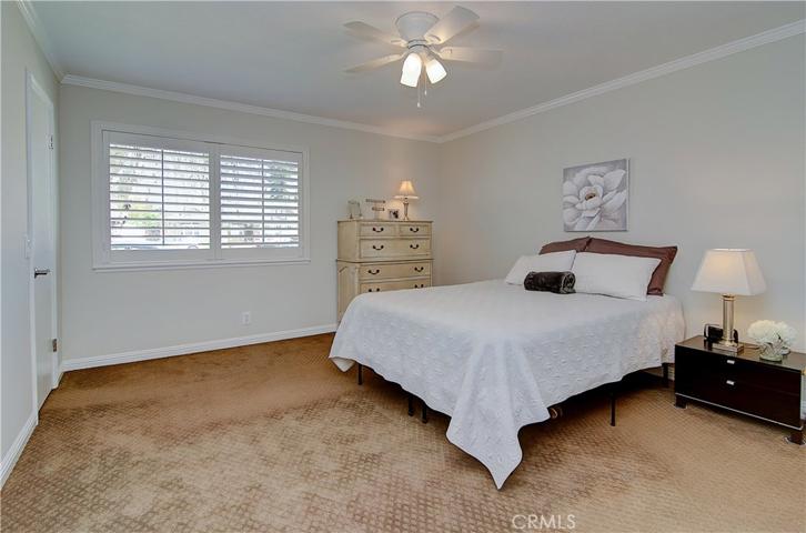 Extra bonuses in this master include plantation shutters, ceiling fan, and a walk-in closet!